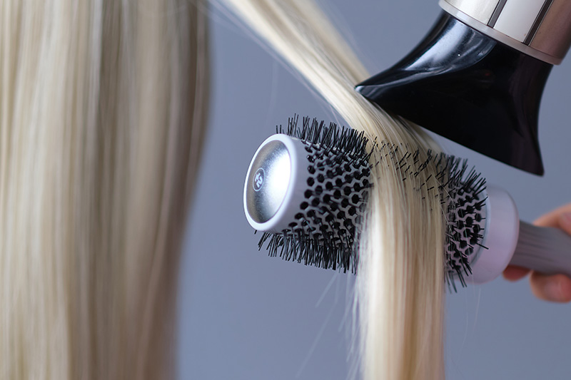 simple minimalist photo, blow dry hair styling. Close-up of hair dryer, concept cut salon, female