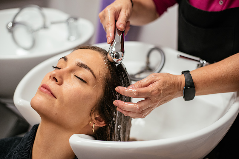 Woman having hair washed